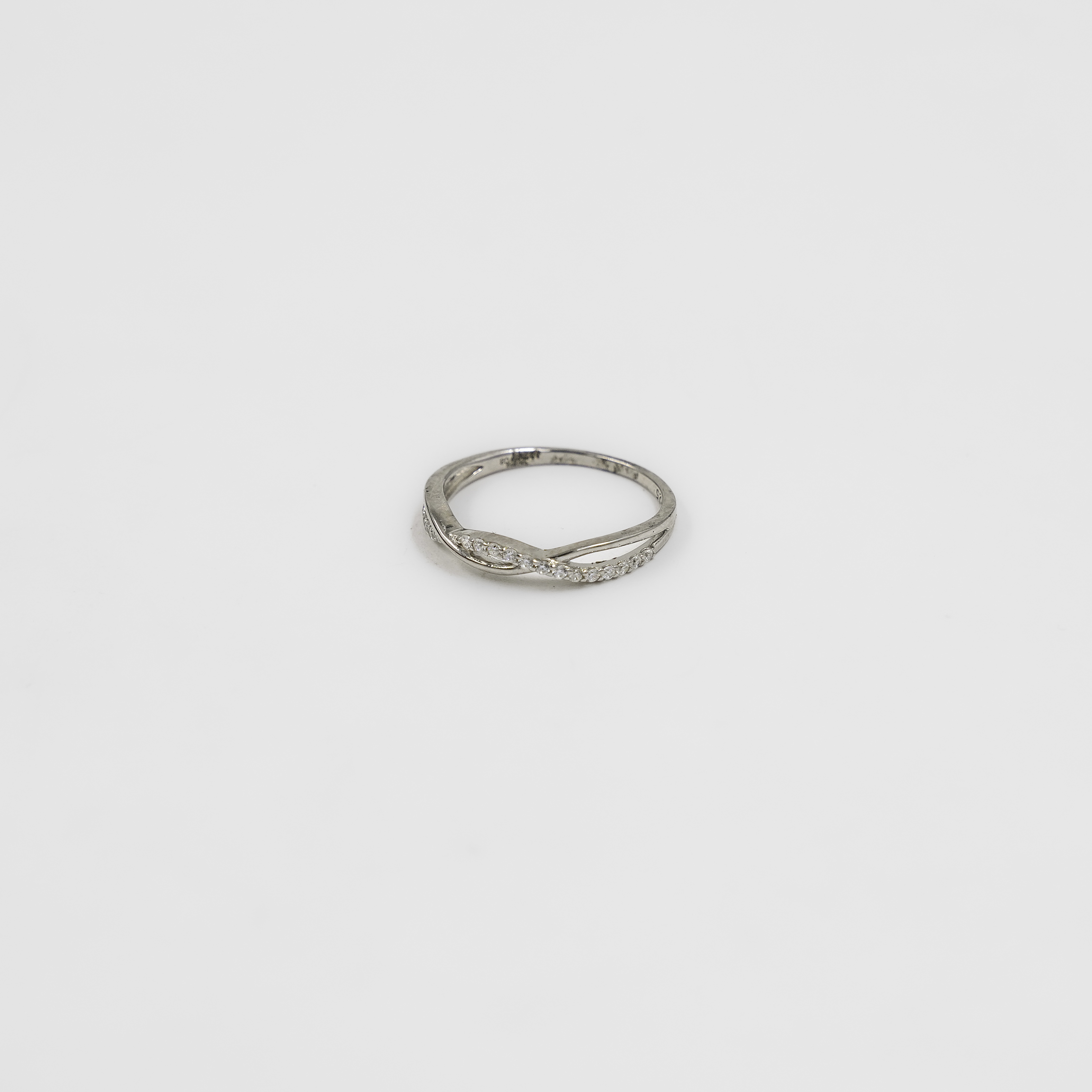 Elegant Silver Ring With Embellished Twist