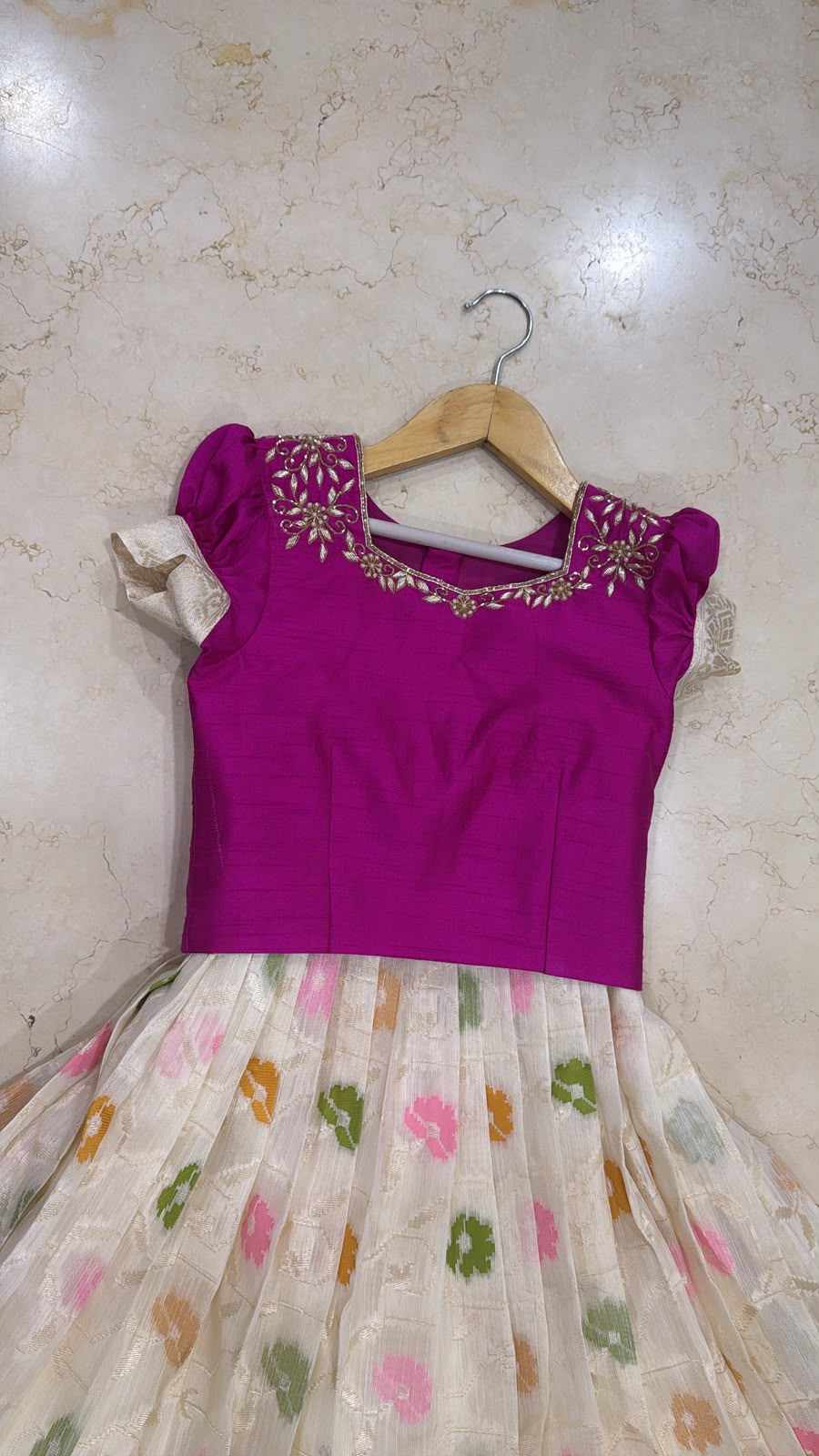 White multi coloured motif lehenga with pink hand work blouse