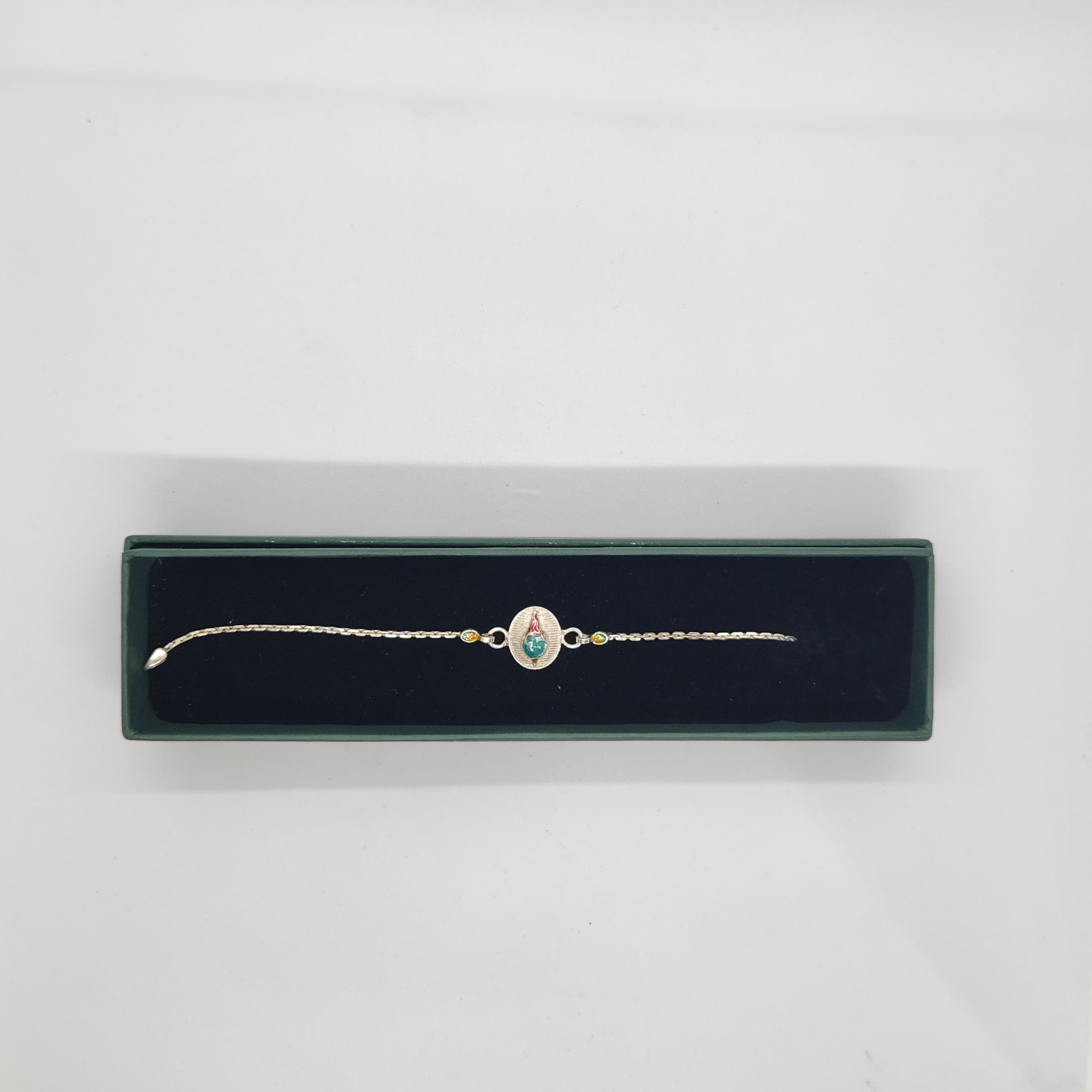 Silver Rakhi with Blue and Red Oval Work - Silver Rakhi