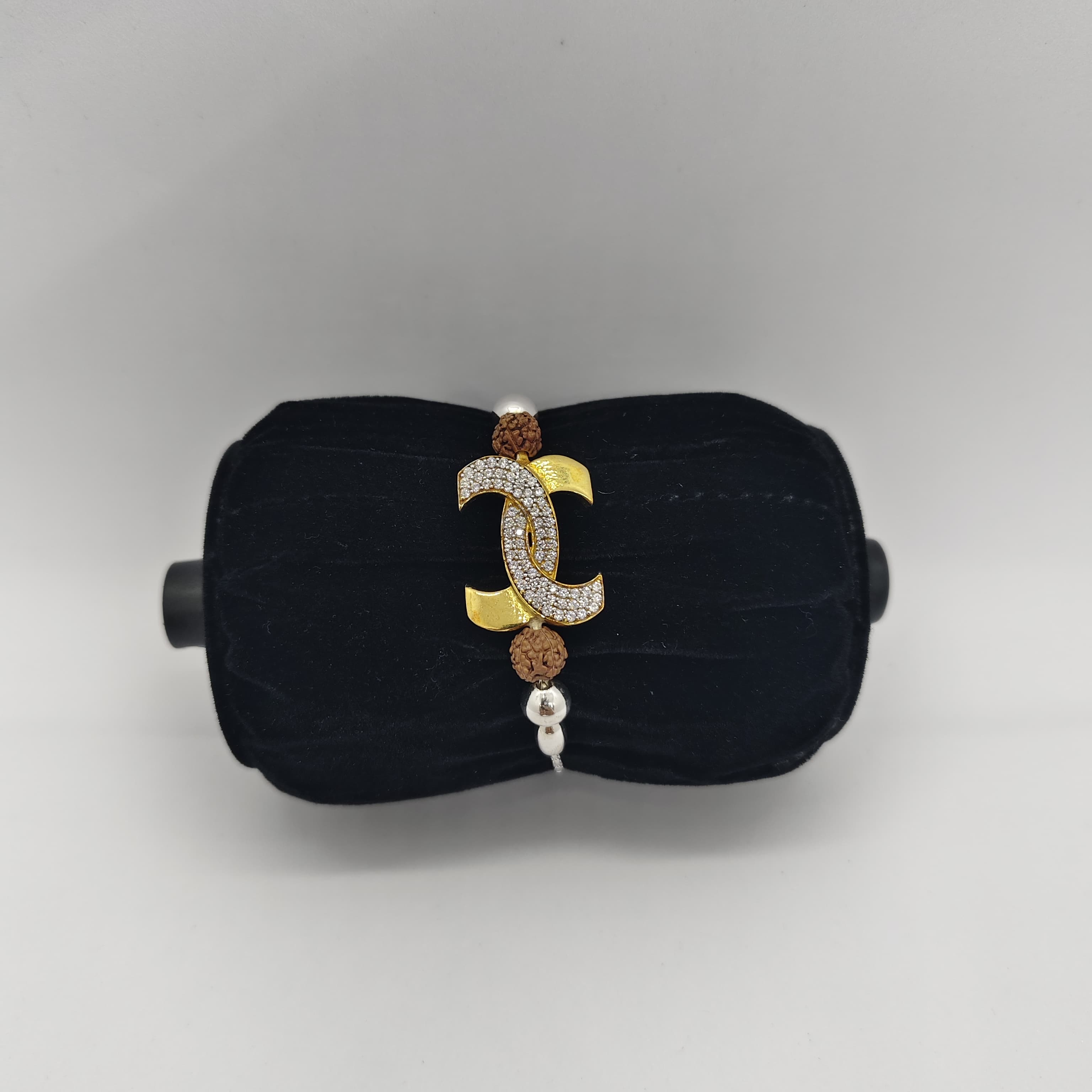 Silver CZ stones Rakhi with Gold Polish and Rudhraksh - Silver Rakhi