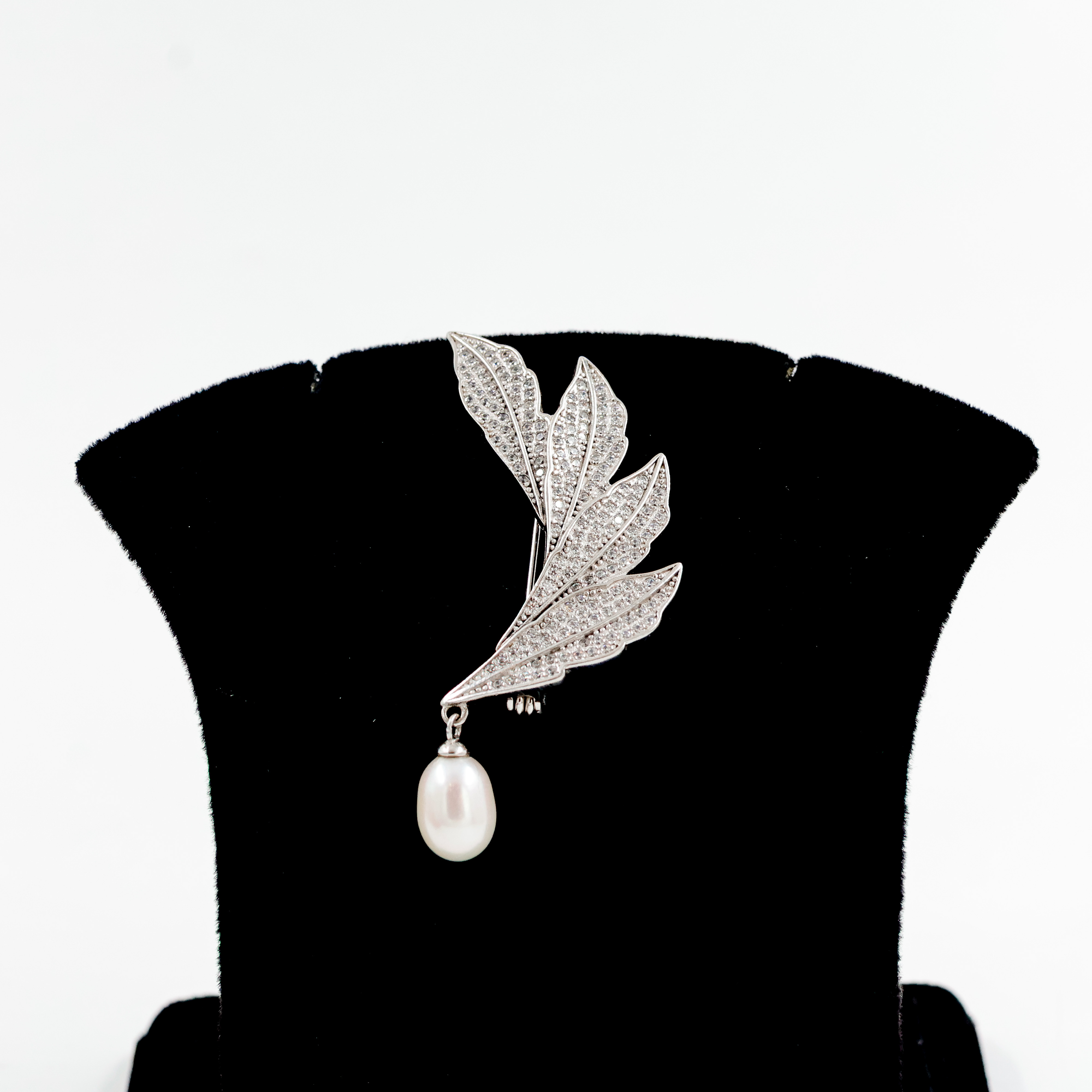 Silver Broucher With Feather Design